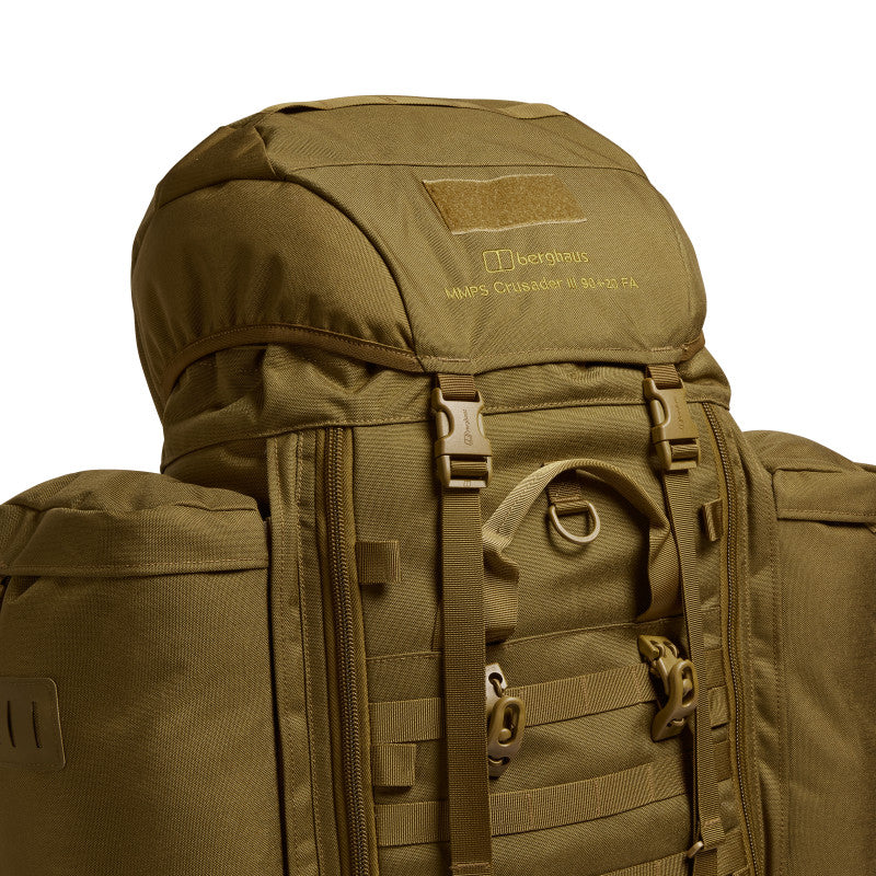 Close-up front detail of the Crusader 90 + 20 FA rucksack showing Berghaus branding, front access buckles, and MOLLE webbing.