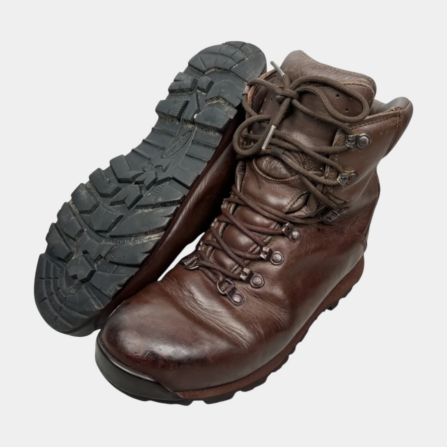 Brown leather Iturri patrol combat boots, pair shown with one boot upright and one tilted to display the black lug sole, British military surplus, transparent cutout