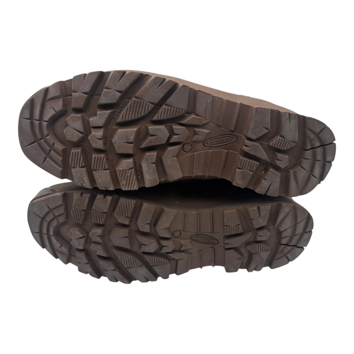 Underside of a pair of Haix Desert suede combat boots, showing brown Defender rubber soles with deep slip-resistant tread.