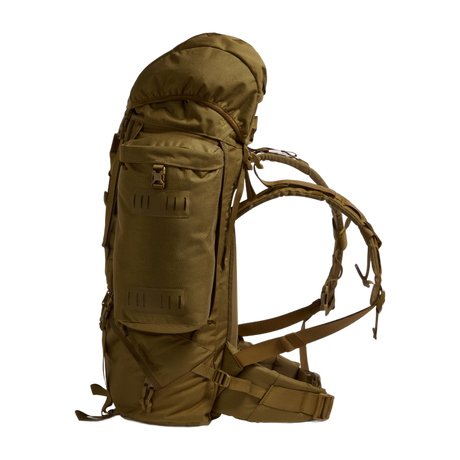Side profile of the Crusader 90 + 20 FA military backpack in earth brown showing compression straps and padded harness system.