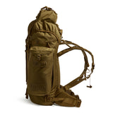 Side profile of the Berghaus Vulcan V MMPS rucksack in earth brown showing side pocket, compression straps, and adjustable harness.