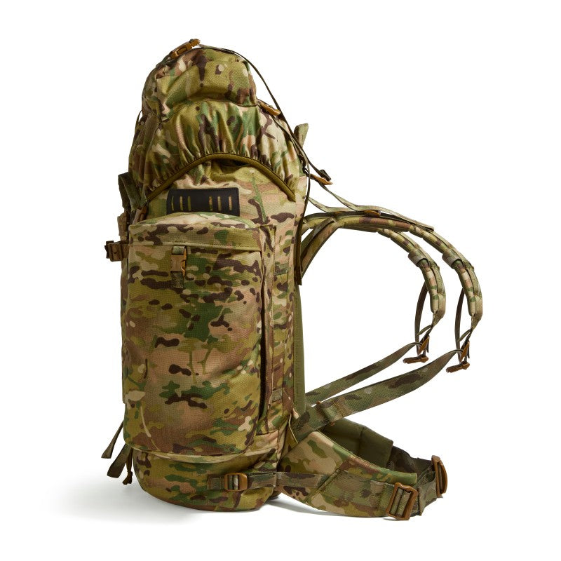 Side profile of the Berghaus Vulcan V MMPS rucksack in MTP multicam camouflage showing side pocket, compression straps, and padded hip belt.