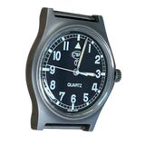 Side profile of CWC G10 quartz military watch showing matte grey case, crown and black dial with CWC oval logo and circled T tritium marking