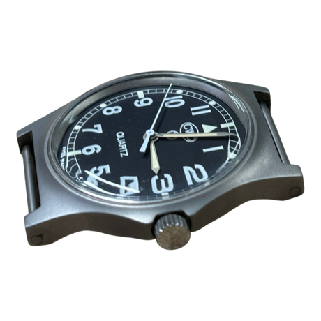Low angle view of CWC G10 military watch showing case profile, acrylic crystal and unsigned crown