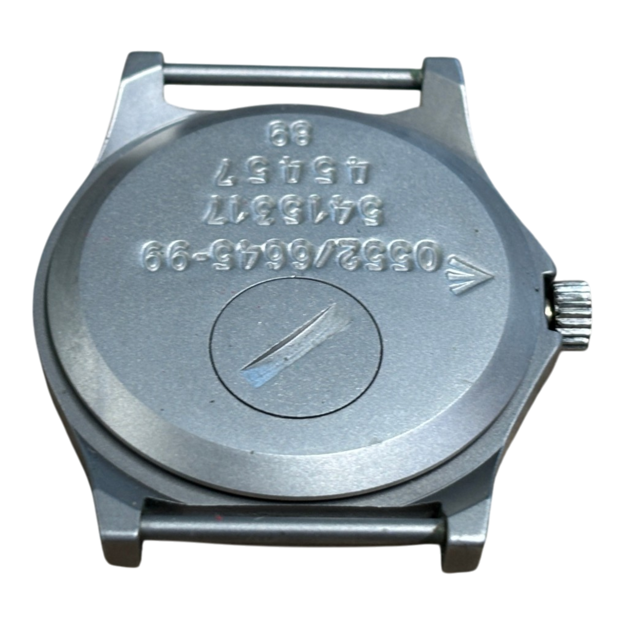 Case back of CWC G10 watch with battery hatch, engraved Broad Arrow, Royal Navy issue markings 0552/6645-99, serial number and 89 date stamp