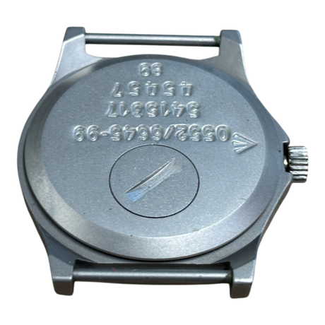 Case back of CWC G10 watch with battery hatch, engraved Broad Arrow, Royal Navy issue markings 0552/6645-99, serial number and 89 date stamp