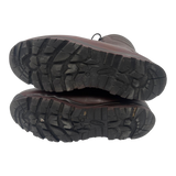 Underside of a pair of brown Karrimor SF combat boots, showing deep-tread rubber soles with Defender markings.