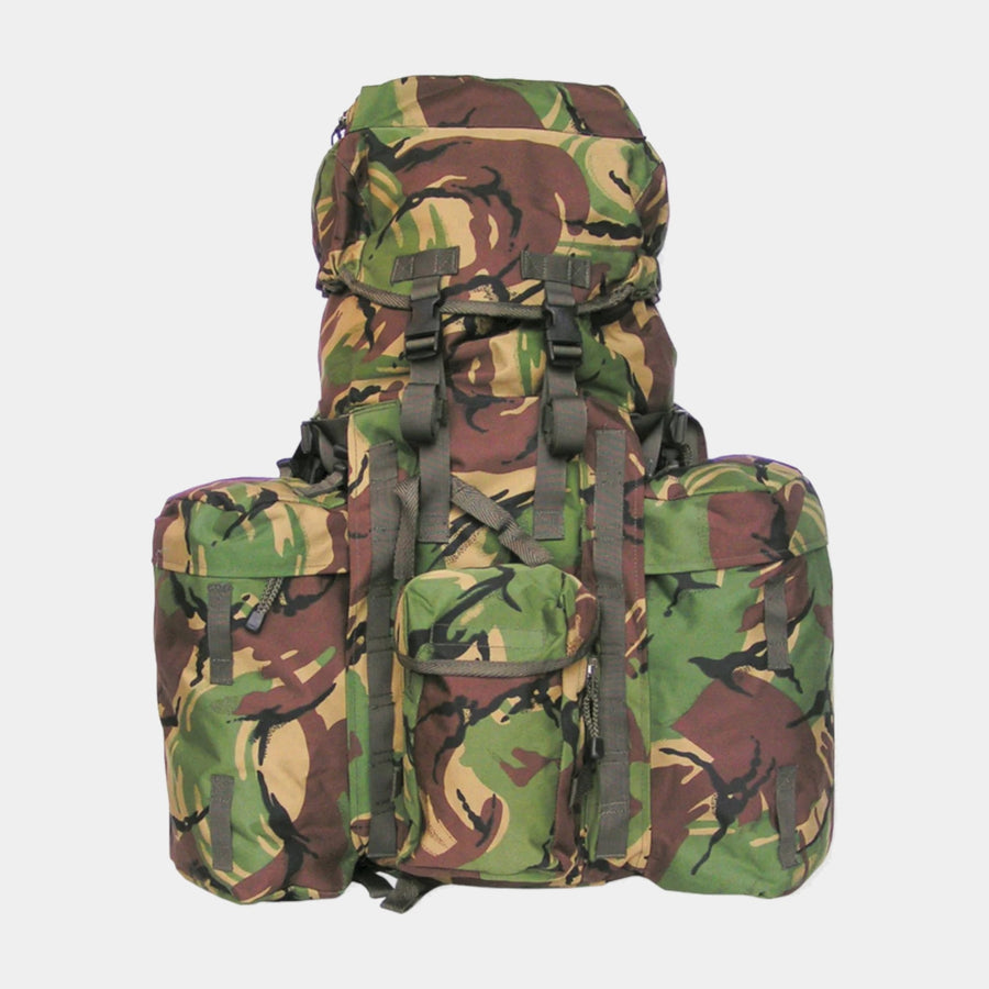 Discover the reliability and ruggedness of the Kombat UK Woodland DPM Bergen Rucksack. With a 120L capacity and 78x60x30cm dimensions, it features a versatile day sack system, multiple pockets, side compression straps, padded shoulder straps, and a waist belt. Made from 600D Tac-Poly with a removable internal aluminium frame.