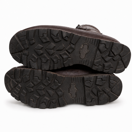 Clean HAIX brown British Army combat boot soles showing authentic terrain tread and used condition