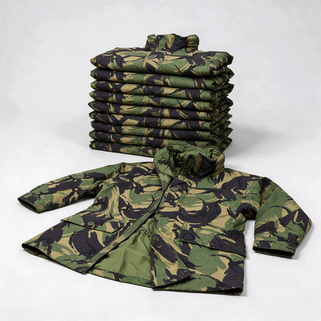 Stack of ten genuine British Army DPM waterproof smocks with one laid out in front - bulk pack of 10