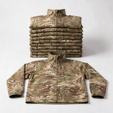 Stack of ten genuine British Army MTP lightweight waterproof Gore-Tex jackets with one laid out in front - bulk pack of 10