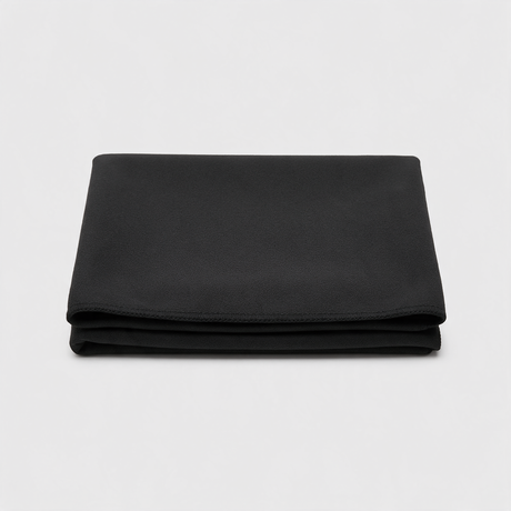Black quick-dry microfibre towel folded, plain with no branding
