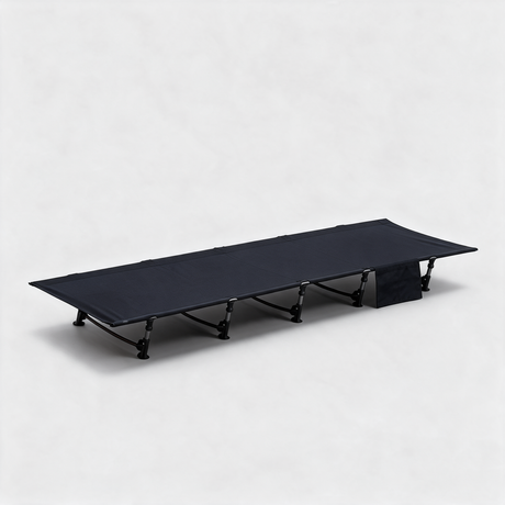 Black ultralight folding camp bed set up, low aluminium frame with side storage pocket