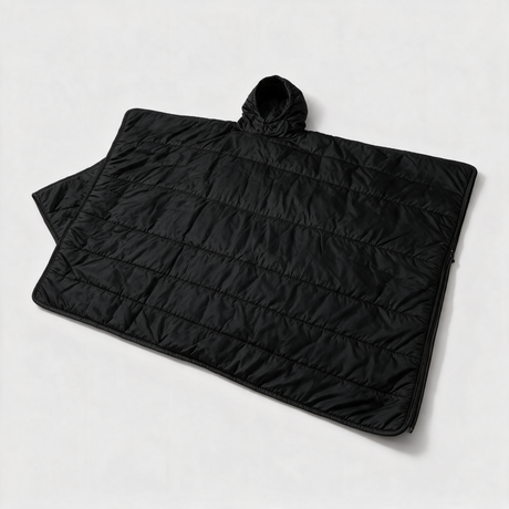 Black Battalion woobie poncho liner laid flat as a quilted camping blanket