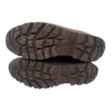 Underside of a pair of Haix Desert suede combat boots, showing brown Defender rubber soles with deep slip-resistant tread.