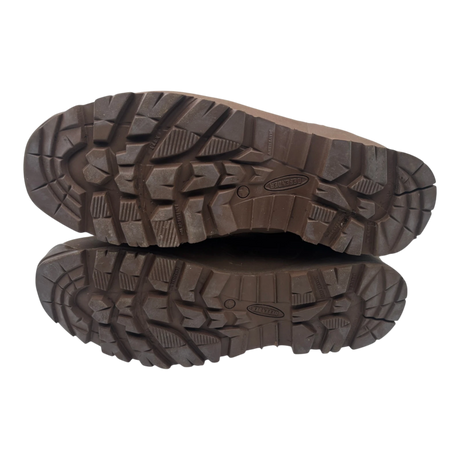 Underside of a pair of Haix Desert suede combat boots, showing brown Defender rubber soles with deep slip-resistant tread.